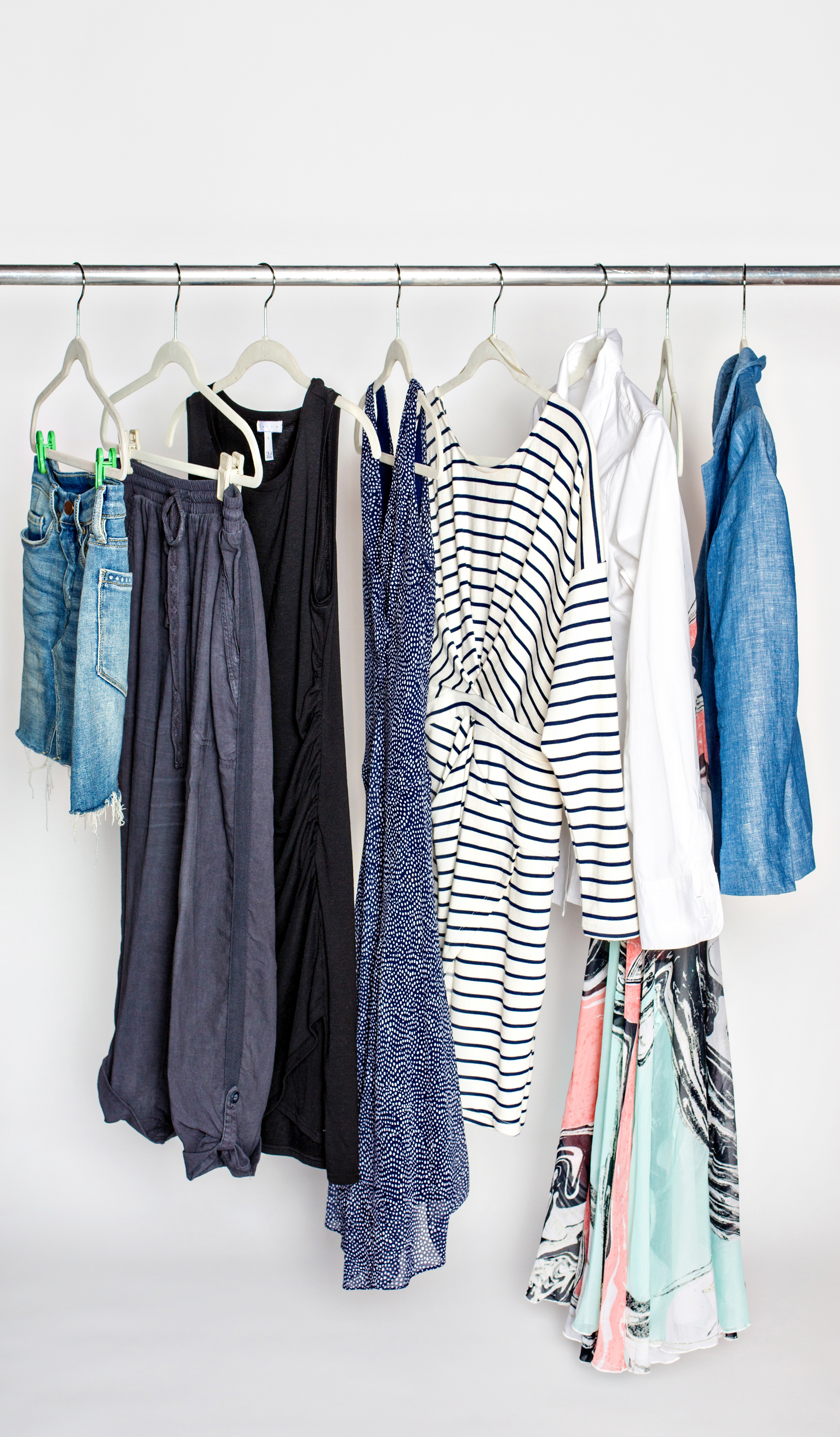 Clothing rack with 10 items in neutral colors